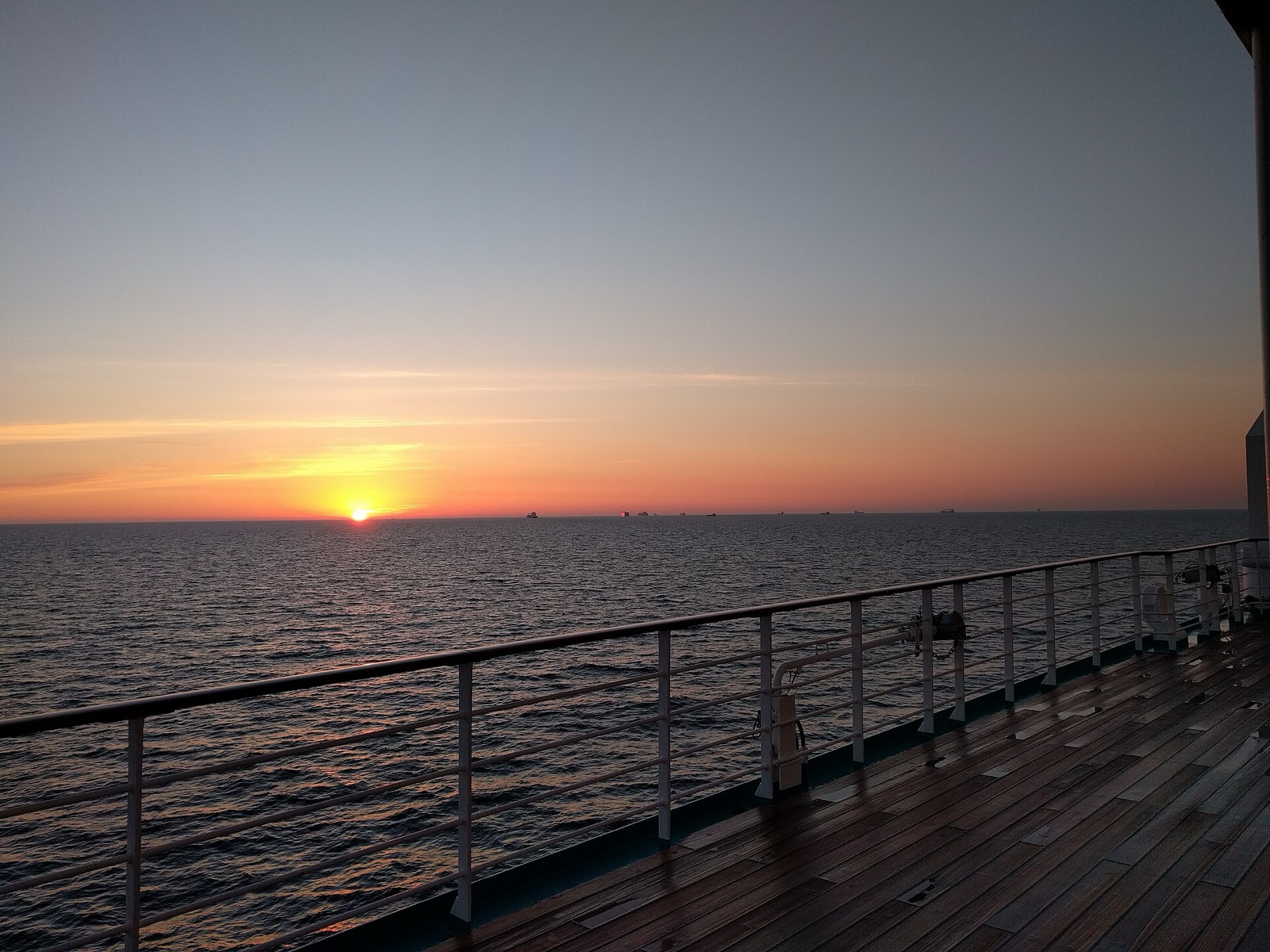 Cruise ship docked in harbor with a calm deck atmosphere